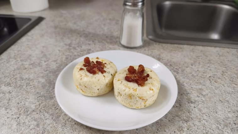 Two copycat Starbucks bacon and Gruyère egg bites on a small white plate