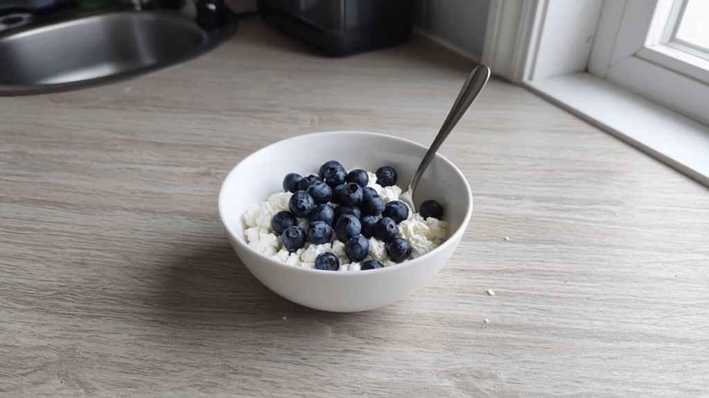 Small bowl of cottage cheese topped with blueberries