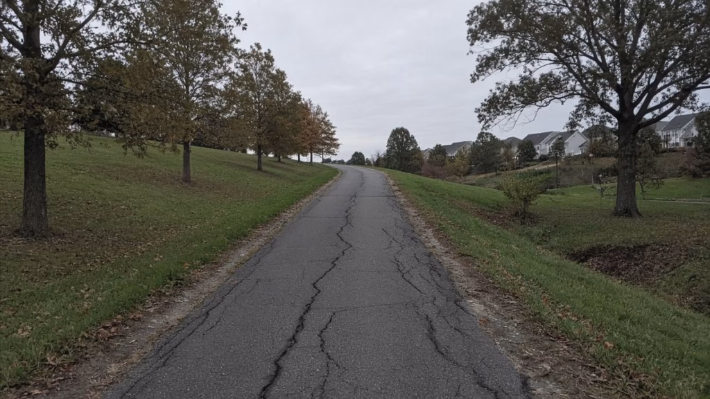 Steep paved walking path up a hill as a 12-3-30 workout without a treadmill