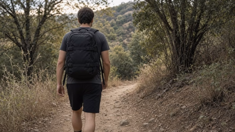 Beginner rucking for weight loss on a dirt trail with a weighted backpack